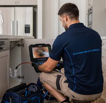 Clearing a blocked sink at a Seven Hills property